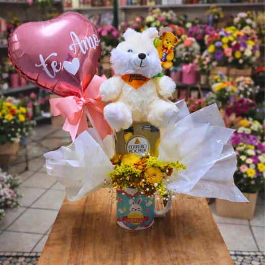 Bouquet de caneca com flores e chocolates  de Pascoa