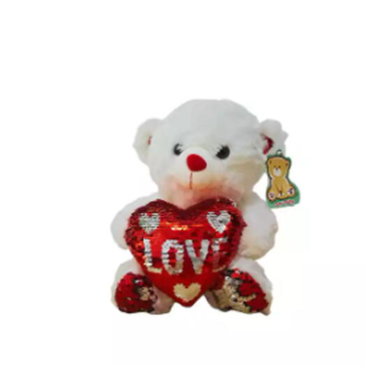 Urso de pelucia com coração vermelho e detalhe em prateado